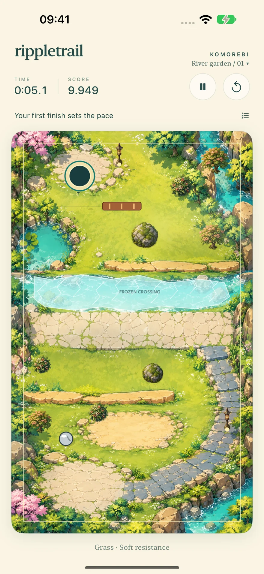 A steel ball below grassy terraces, stone paths and a frozen crossing in River garden.