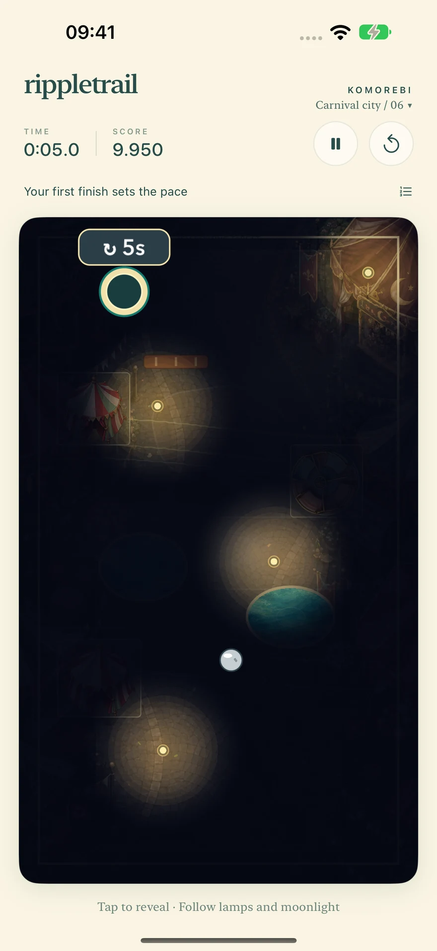 A dark carnival course illuminated by lanterns, with the ball and finish visible.